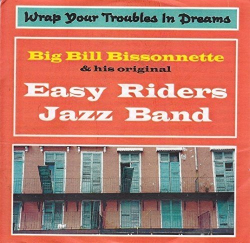 "CD cover art: man playing trumpet, abstract background, red border, text at top."