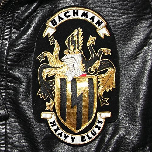 "Black leather jacket patch with gold crest and 'Bachman Heavy Blues' text."