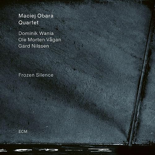 CD cover for Maciej Obara Quartet’s “Frozen Silence,” dark textured background.