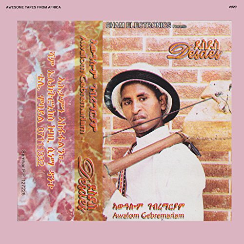 Cassette cover featuring a portrait of Awalom Gebremariam with text.