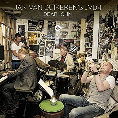 "Album cover featuring a jazz band playing instruments in a cluttered room."