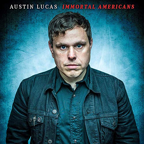 Album cover featuring a man in a denim jacket against a blue background.