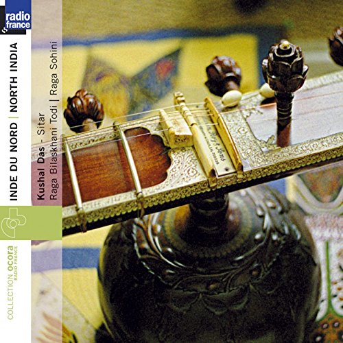 "CD cover featuring a close-up of a sitar's headstock and tuning pegs."