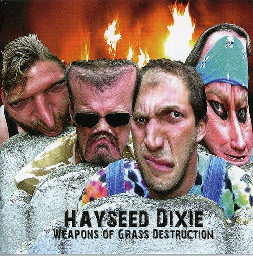 "Album cover with four men's faces emerging from a hole, flames in the background."