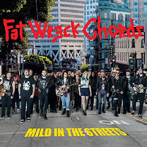 CD cover: band posing on a city street with buildings backdrop.