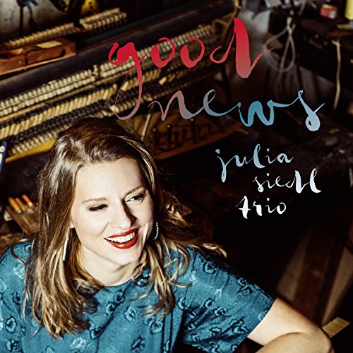 CD cover featuring a woman with a piano and text “Good News”.