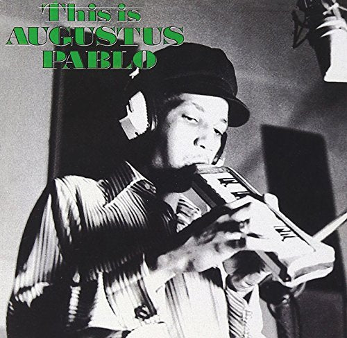 "Black and white album cover featuring Augustus Pablo playing a keyboard."
