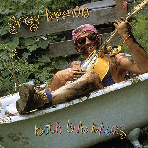 Greg Brown album cover: musician in a bathtub playing guitar.