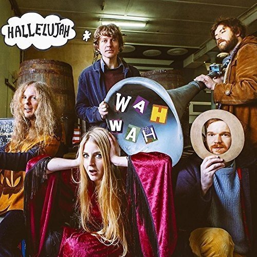"Vinyl record cover featuring five people posing in a warehouse setting."