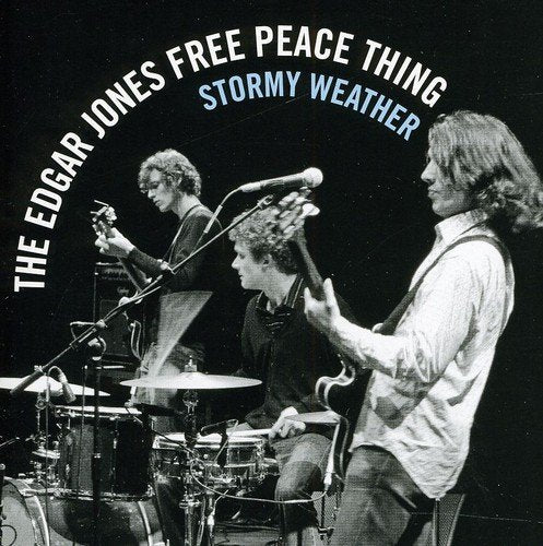 "CD cover featuring black-and-white photo of three musicians playing instruments on stage."