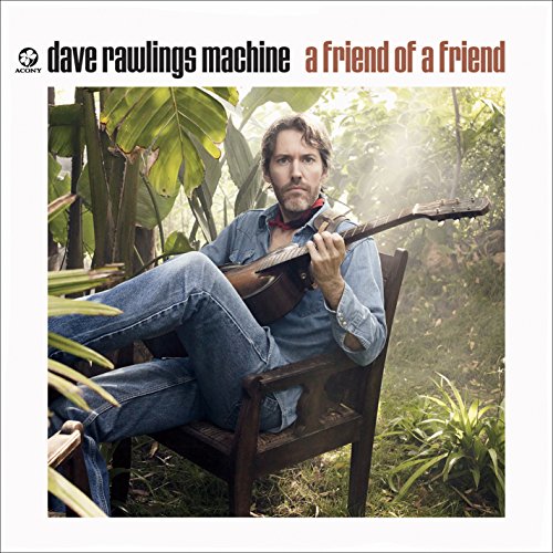 "Album cover with a man sitting in a chair, holding a guitar."