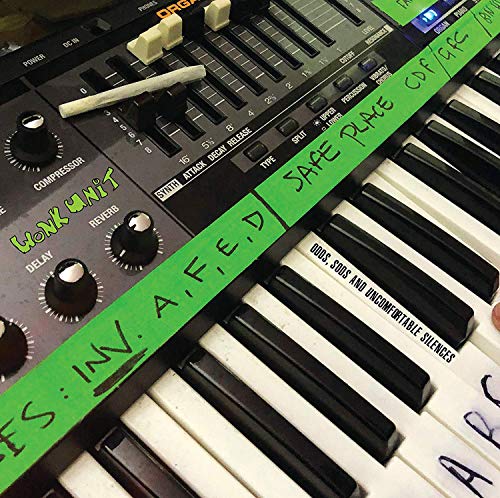 Green synthesizer keyboard with handwritten album title "Wonk Unit" visible.