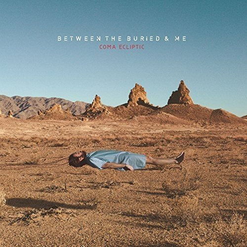 "Album cover featuring a man lying in a desert landscape with rocky formations."