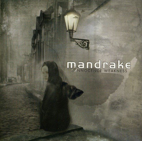 CD cover: hooded figure on a cobblestone street under a lamppost.