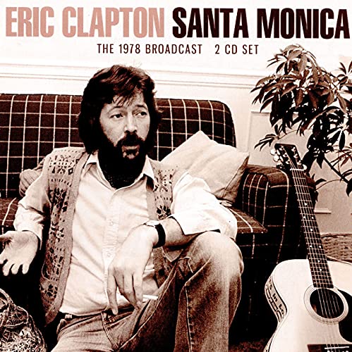 Eric Clapton album cover, sepia-toned photo of a man with a guitar.