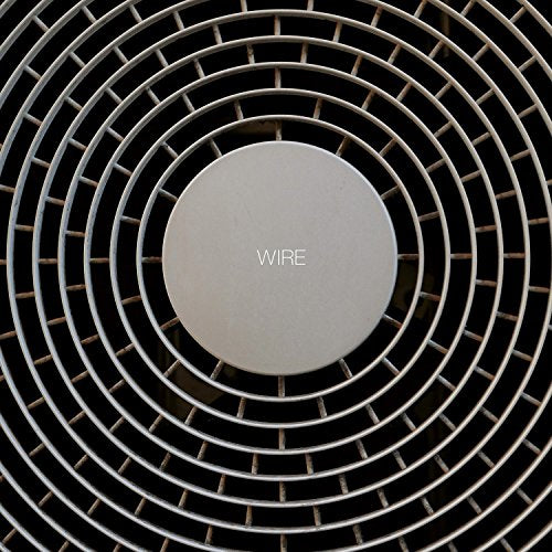 Vinyl record with concentric grooves and the word "WIRE" centered.