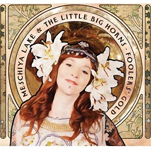 Album cover featuring a woman with flowers in her hair and ornate background.