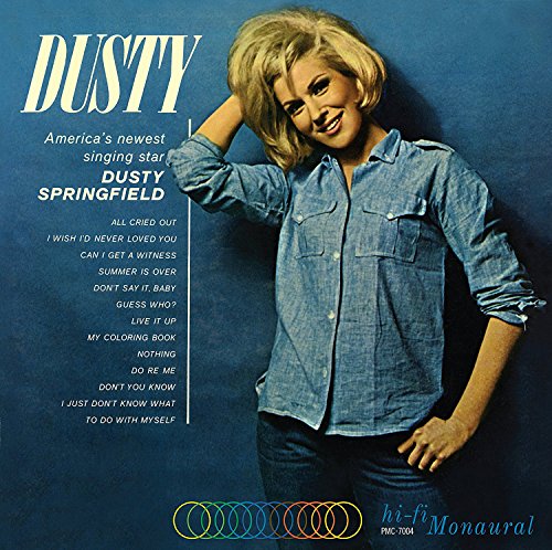 "Dusty Springfield album cover featuring a blonde woman in denim shirt against blue background."