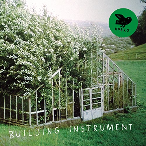 CD cover with a greenhouse overgrown with foliage and text.