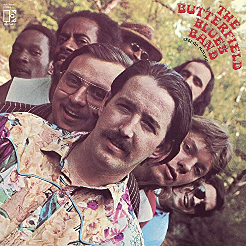 Vinyl record cover featuring a group of men in a wooded area.