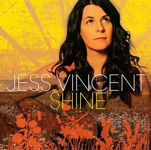 Album cover featuring a woman with long dark hair against a yellow background.