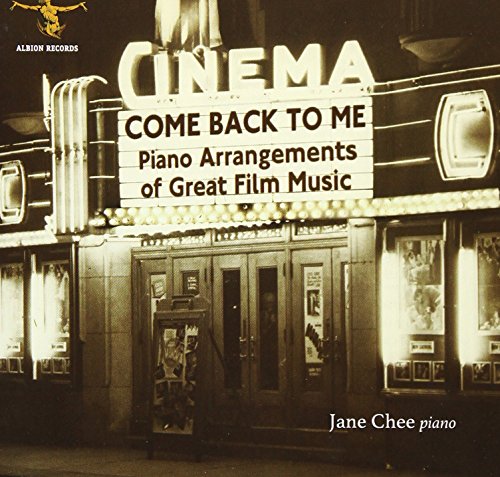 "Sepia-toned album cover featuring a vintage cinema facade with marquee and lit entrance."