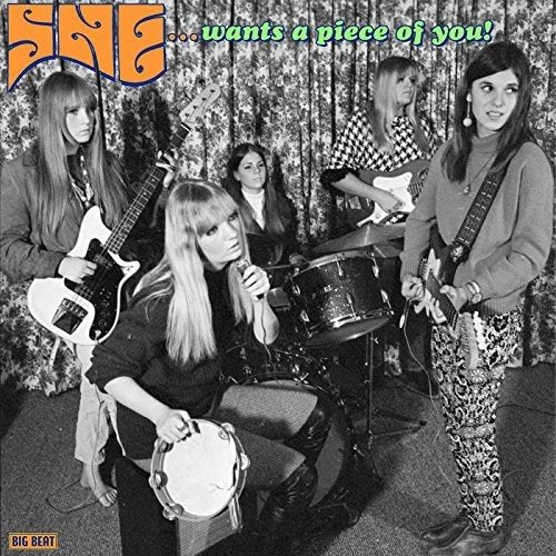 SHE album cover featuring a 1960s all-female rock band.