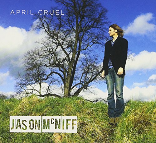 "Album cover with a man standing in a grassy field with a bare tree."