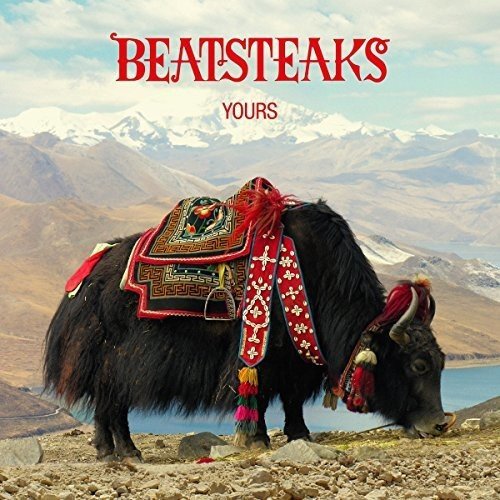 "CD album cover featuring a yak with colorful saddle in a mountainous landscape."