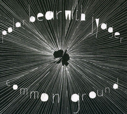 "Black album cover with white text and radial lines, featuring a central dark shape."