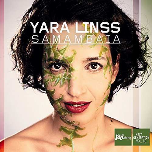 "CD cover featuring a woman with green paint on her face and dark hair."