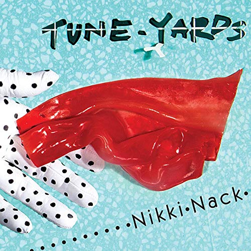 Album cover for Tune-Yards’ “Nikki Nack” featuring a hand and red object.
