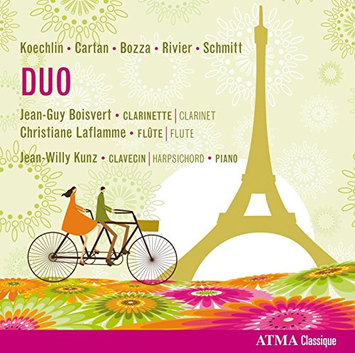A CD cover featuring a couple riding a tandem bicycle near the Eiffel Tower.