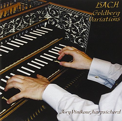 "CD cover featuring a person playing a harpsichord with ornate design."