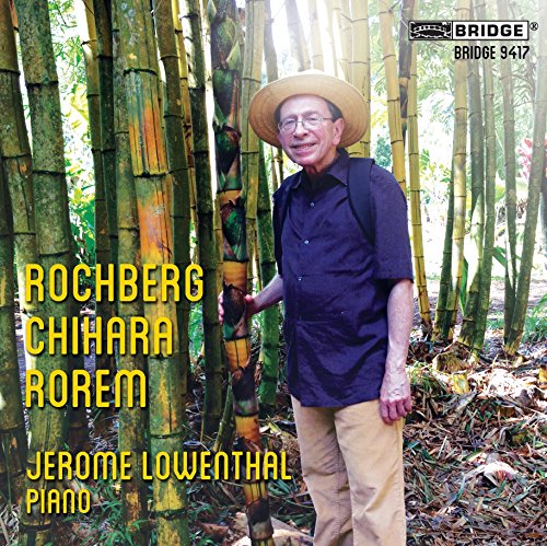 "Album cover featuring Jerome Lowenthal in a bamboo forest, wearing a hat and blue shirt."