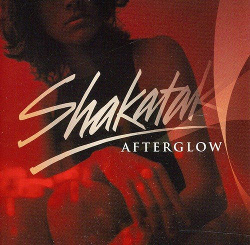 Red album cover with "Shakatak" in cursive and "Afterglow" in white text, featuring a woman.