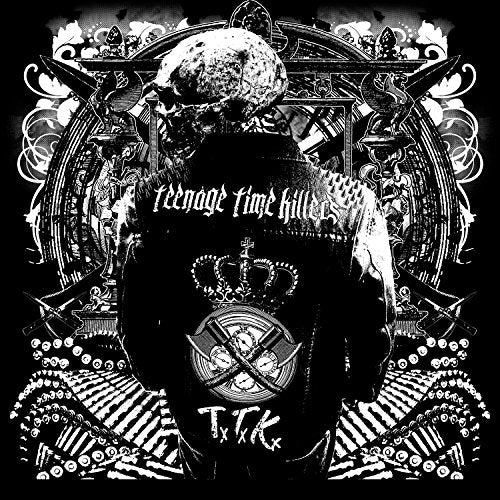 "Black and white album cover with skull and ornate designs."