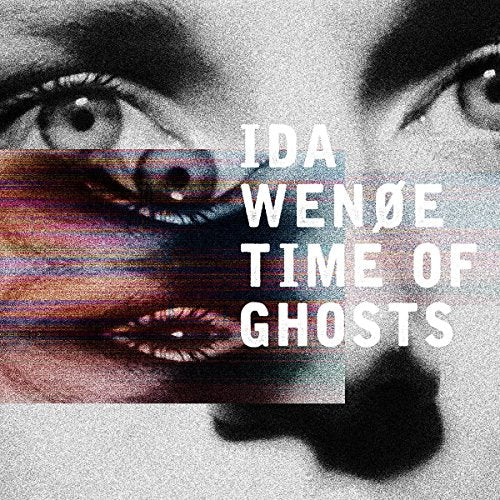 "Album cover with a close-up of a woman's face, distorted and glitchy effect."