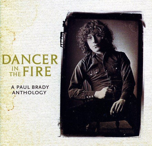 "CD cover with sepia-toned photo of Paul Brady and gold title text."