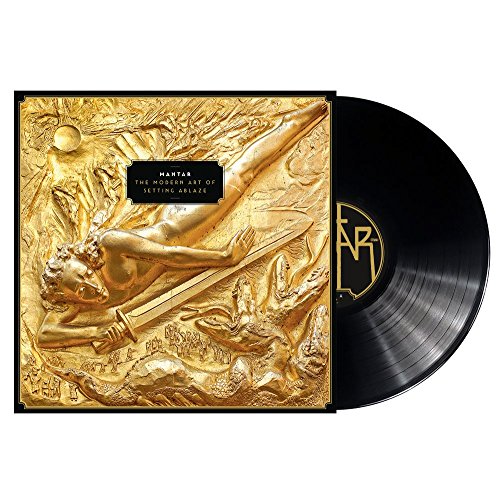 Gold-textured vinyl record cover with reclining figure and black disc.
