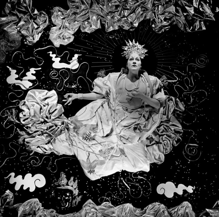 Black and white album cover featuring a woman with a halo and swirling shapes.
