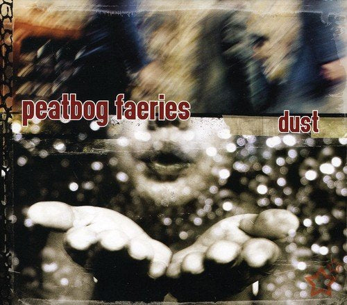 "Album cover with a face and hands surrounded by sparkles, titled 'Peatbog Faeries - Dust'."