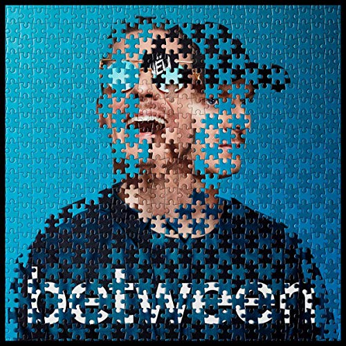 Man’s face composed of puzzle pieces on a blue background.