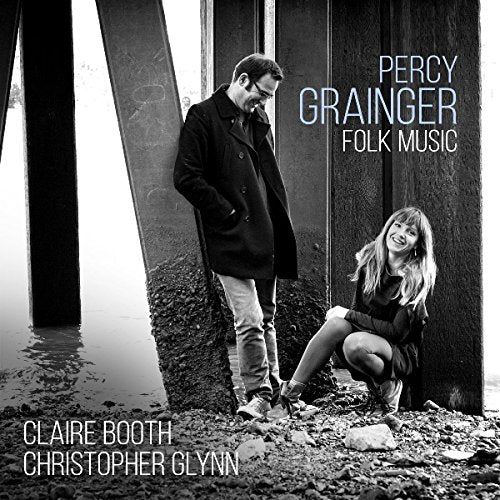 Black and white album cover with a man and woman beside a body of water.