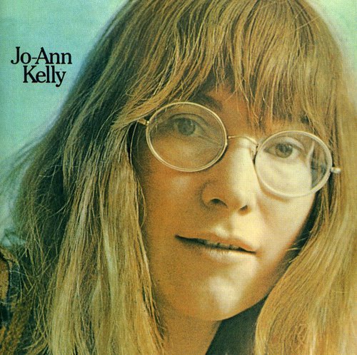 "CD cover featuring a close-up of a woman with long blonde hair and glasses."