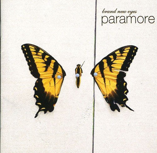 "CD album cover with butterfly artwork, split down the middle, on beige background."