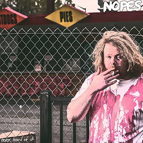 Vinyl album cover featuring a man smoking by a chain-link fence.