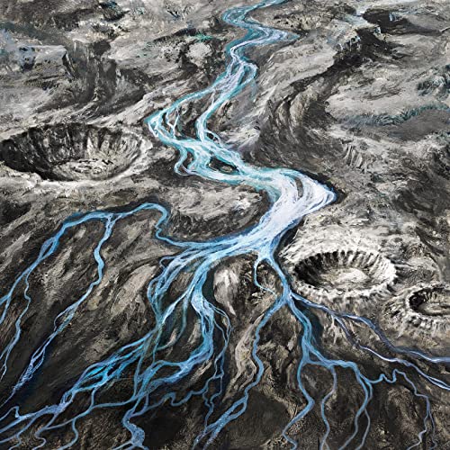 Aerial view of a winding, bright blue river through grey, rocky terrain.