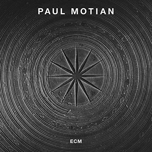 "Album cover with a gray circular design and white text reading 'Paul Motian' and 'ECM'."