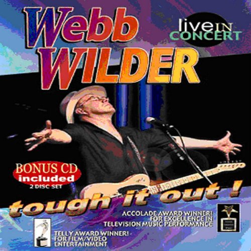 "Webb Wilder playing guitar on stage with arms outstretched, wearing a white hat."